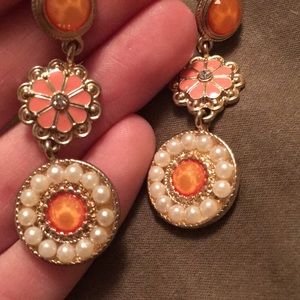 Orange, peach, and pearl colored earrings